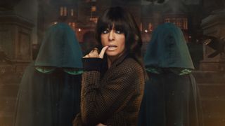 Claudia Winkleman posing in front of two hooded figures to promote The Traitors season 2