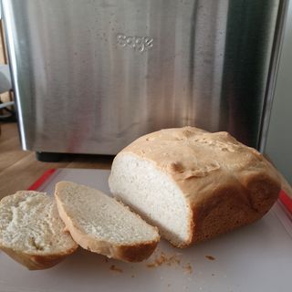 Sliced white loaf of bread made in the Breville Custom Loaf Bread Maker