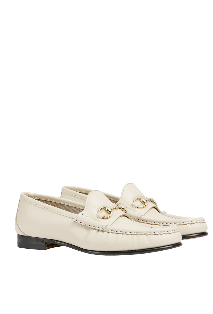 An image of Gucci&#039;s white loafers. 