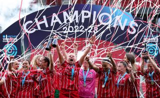 Players of Bristol City celebrate as Fran Bentley ( not pictured ) lifts the Women's Championship Trophy after securing promotion to the Women's Super League after defeating Charlton Athletic during the Barclays FA Women's Championship match between Bristol City and Charlton Athletic at Ashton Gate on April 23, 2023 in Bristol, England.
