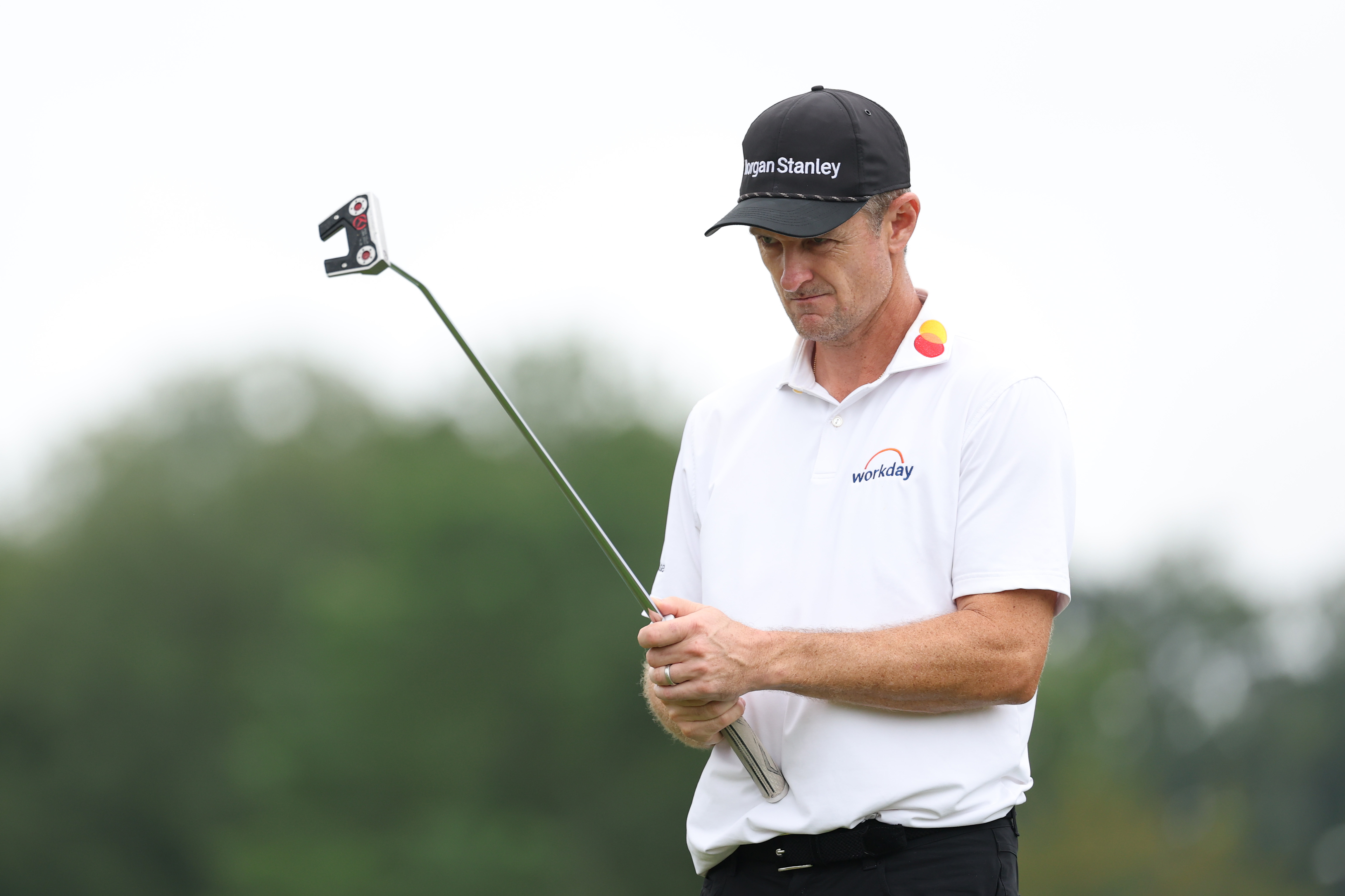 Justin Rose lines up a putt
