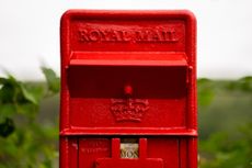 Distinctive red Royal Mail box for letters, post and mail. - stock photo