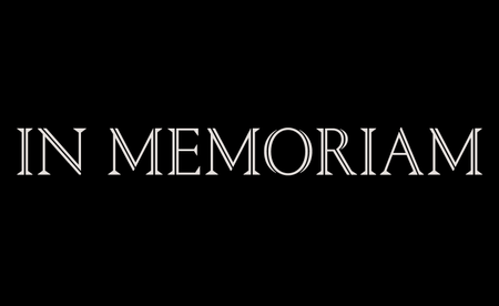 In memoriam in white type on black background