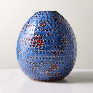 A blue egg-shaped vase