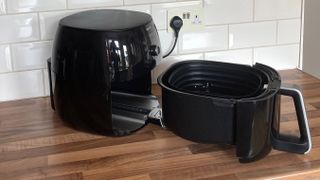 The drawer of the Philips Airfryer XXL HD9650/99 extended on its runners