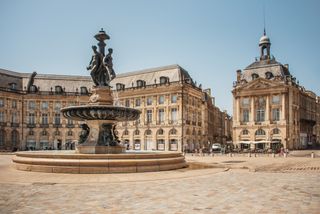 Place de la Bourse one of the most famous landmarks in Bordeaux, one of the best foodie cities in France.