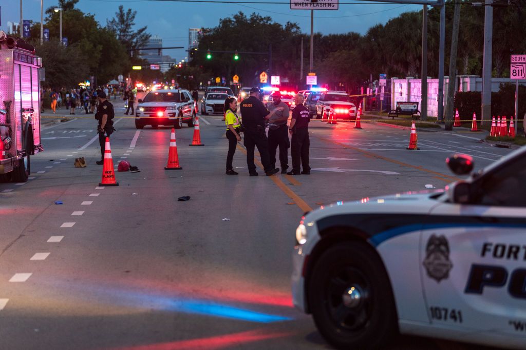 Police investigate the scene where a pickup truck drove into a crowd of people at a Pride parade on June 19, 2021 in Wilton Manors, Florida.