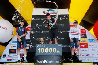 Thymen Arensman celebrates his first pro win on the podium of stage 6 of Tour de Pologne 2022