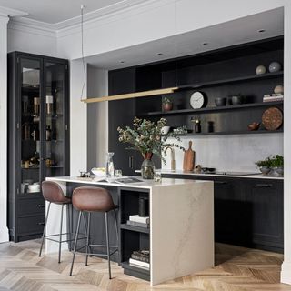 kitchen with black wall shelf and white countertop