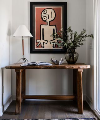 entryway vignette with large modern art