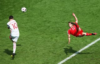 Xherdan Shaqiri scores an overhead kick for Switzerland against Poland at Euro 2016.