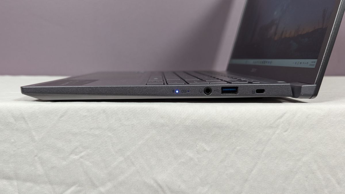 Acer Aspire 14 AI's right-side ports on a white table against a gray background.