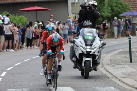 Victor Campenaerts rides in front of a TV camera motorbike at the 2023 Tour de France