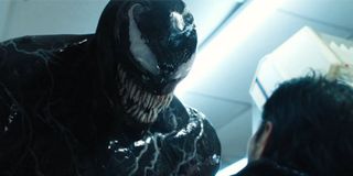 Venom threatens a dude in a convenience store Tom Hardy 2018