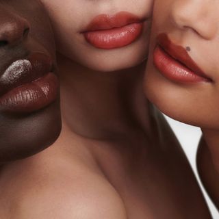 Three models wearing Augustinus Bader x Sofia Coppola tinted lip balms