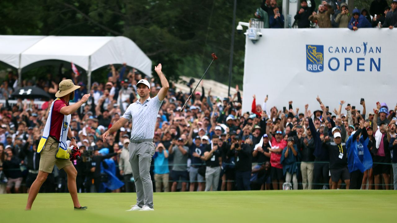 Nick Taylor of Canada celebrates with his caddie after making an eagle putt on the 4th playoff hole to win the RBC Canadian Open at Oakdale Golf &amp; Country Club on June 11, 2023