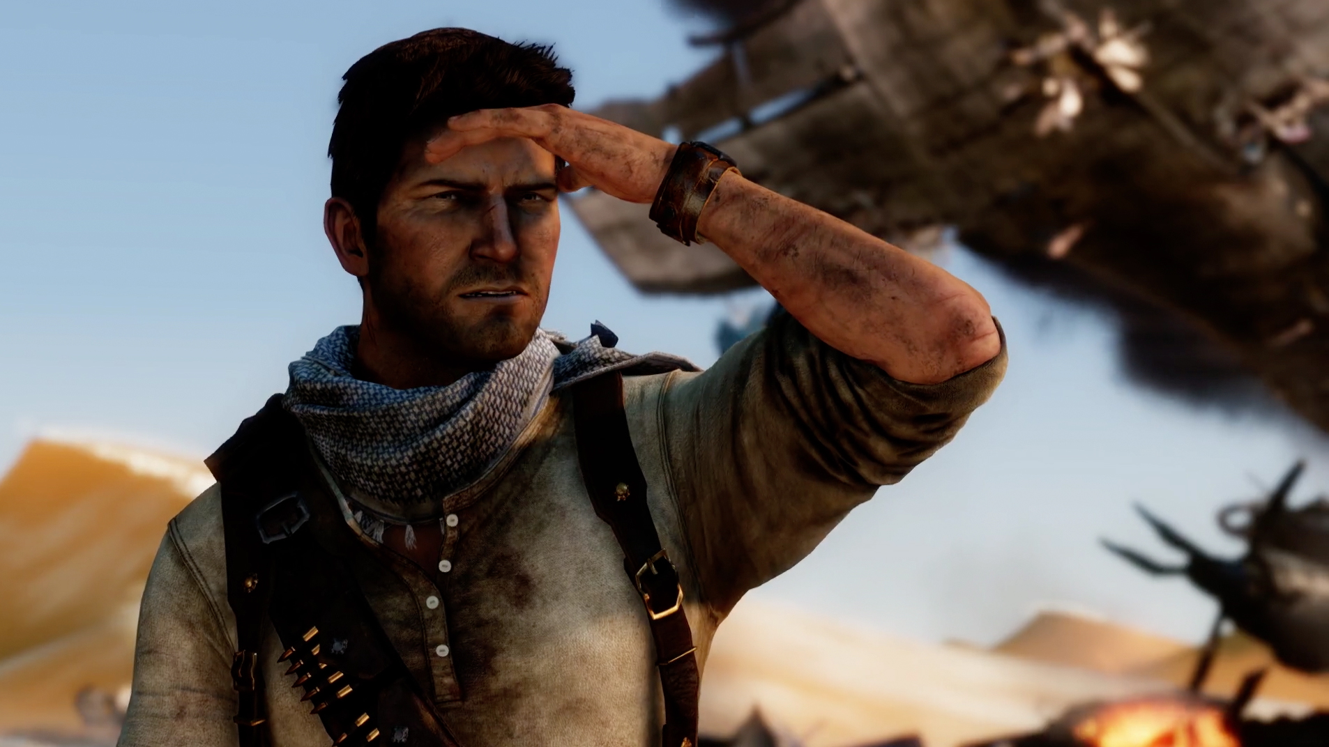 Uncharted, Nathan Drake close-up, shielding his eyes against the sun - Best PS4 Pro Games