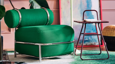 a green inflatable chair and a small maroon side table