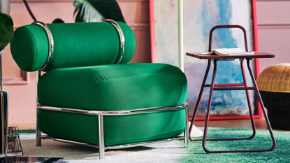 a green inflatable chair and a small maroon side table