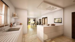 white modern kitchen diner in a garage conversion, with a tiled floor and a white attached island, and a dining table near the french doors at the end of the room