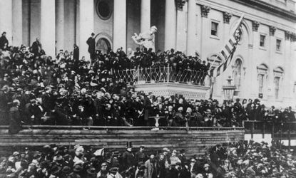 Lincoln delivers his second inaugural from a small white podium, seen in the center of the photograph. 