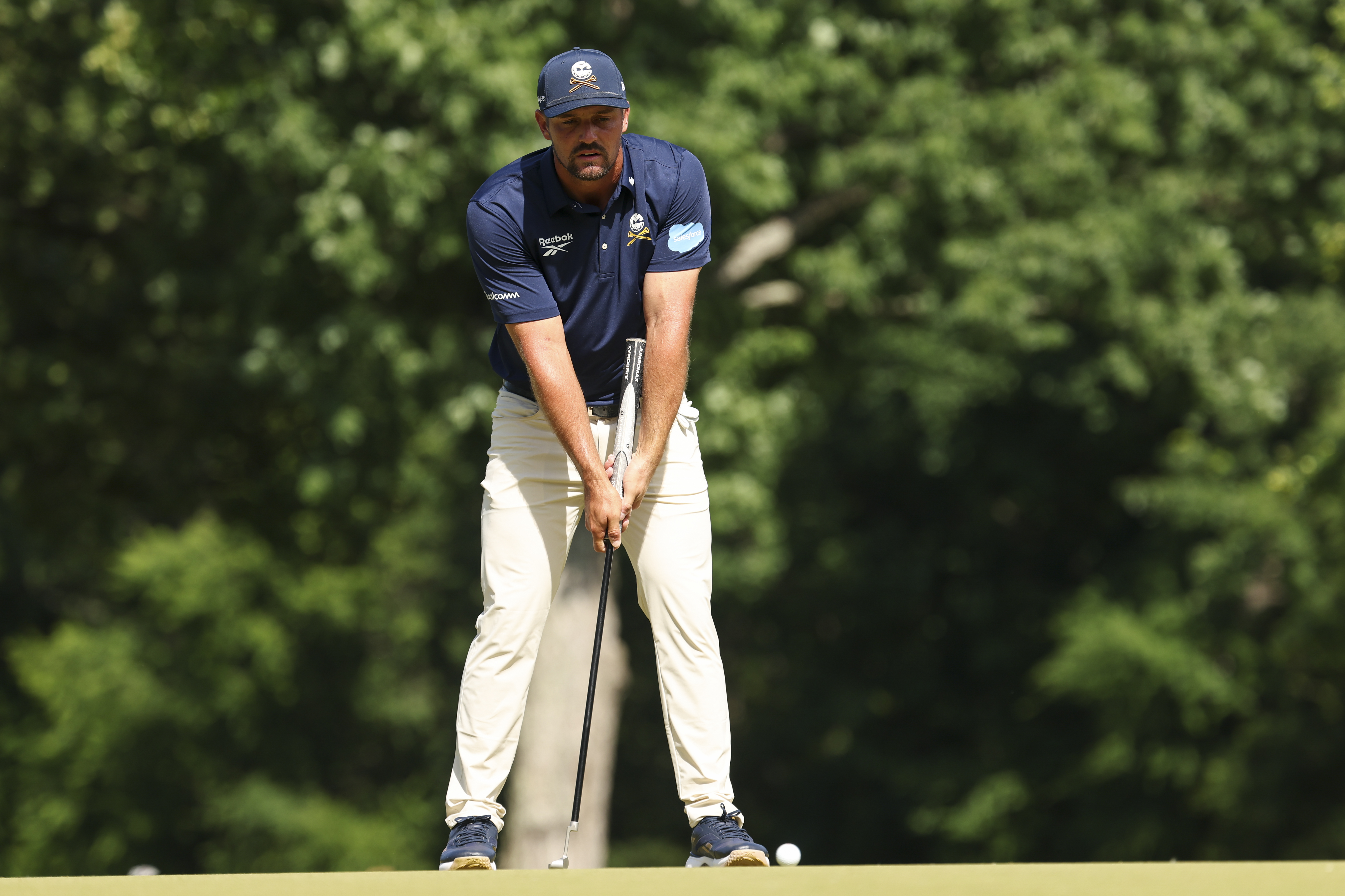 Bryson DeChambeau putter stroke rehearsal