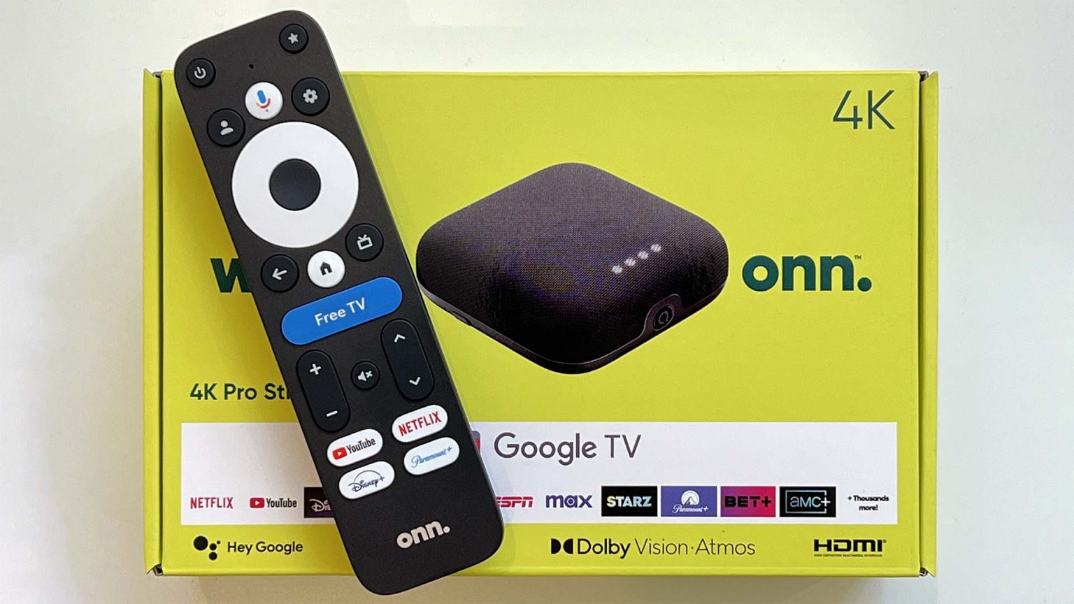 A Walmart Onn 4K Pro box with a remote sitting on top