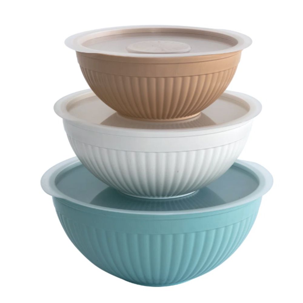 Stack of three plastic bowls with lids in different colors 