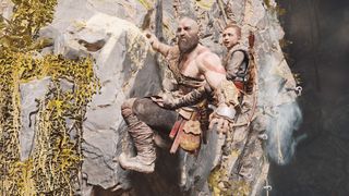 Atreus rides on Kratos' back as he climbs a mountain-side in God of War (2018)
