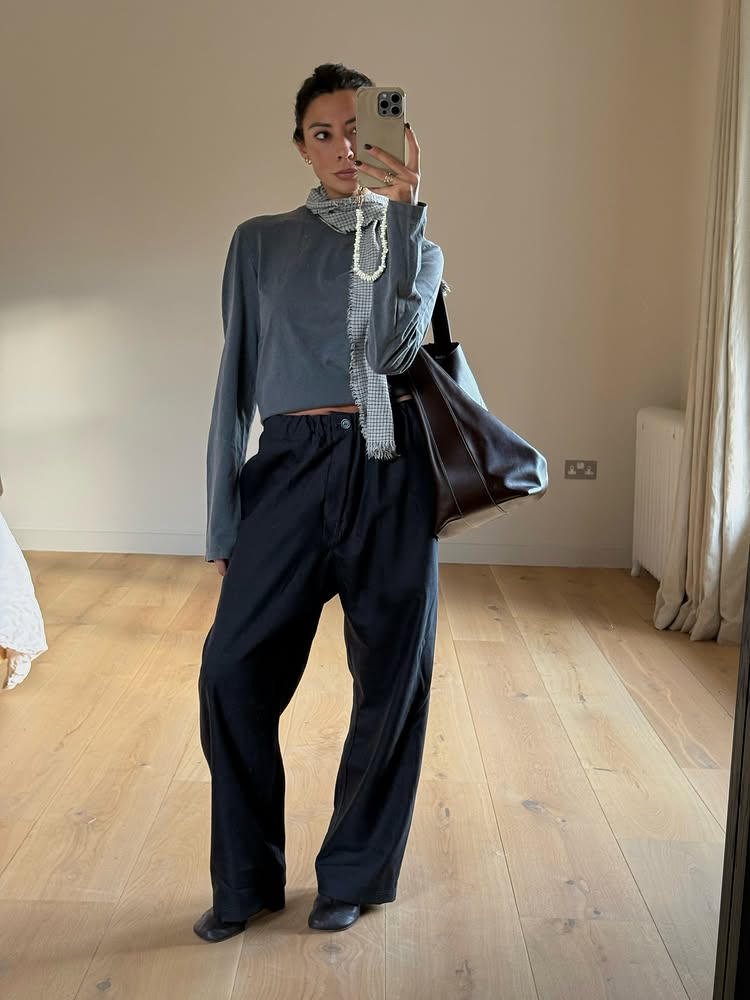 An image of @smythsisters wearing one of the biggest shoe trends of 2026, sock boots.