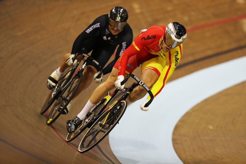 Simon van Velthooven of New Zealand and Juan Peralta Gascon of Spain compete in the first round of the Men's Sprint