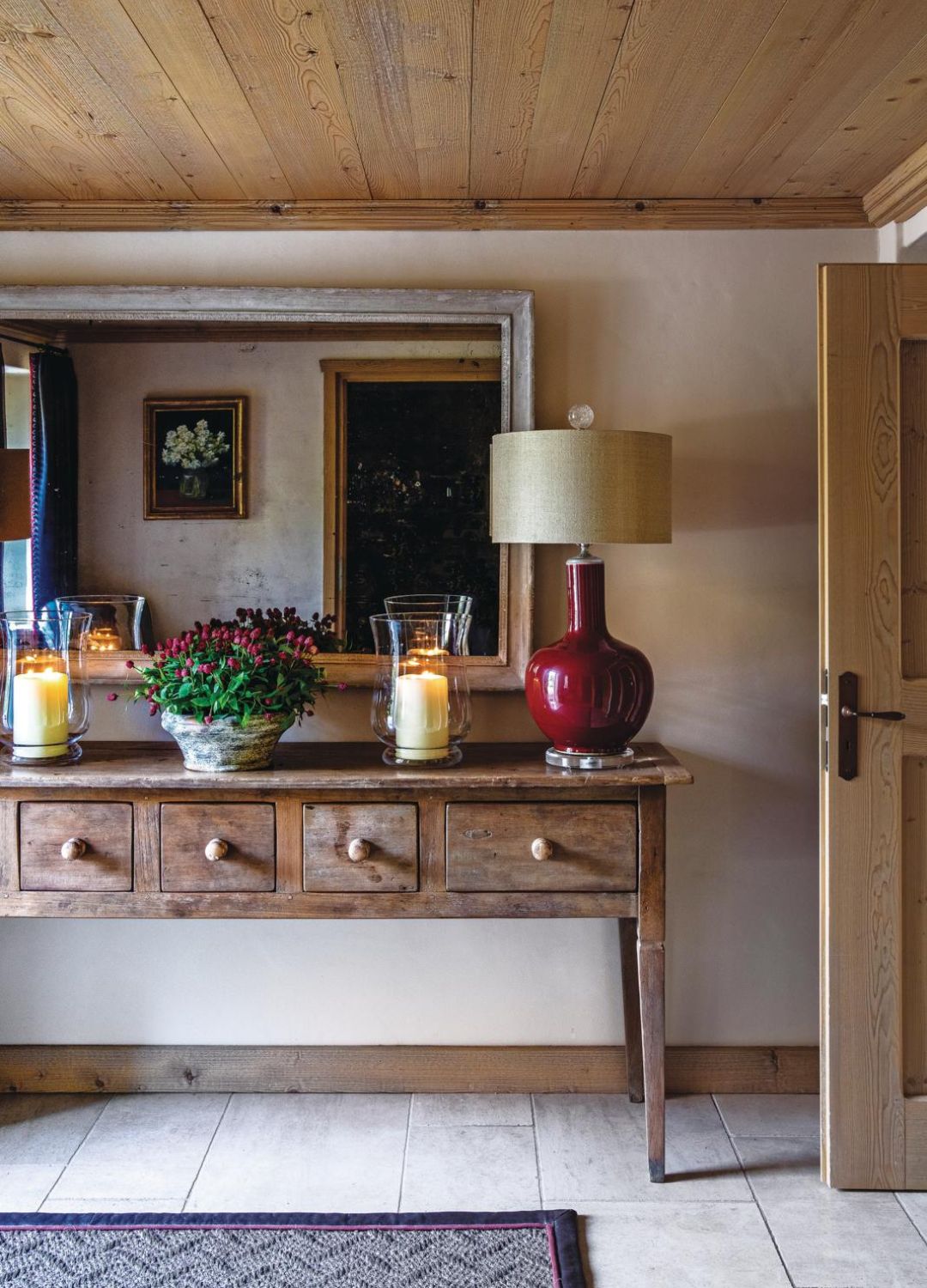 picture of a chalet inspire space with side table, candle and lamp