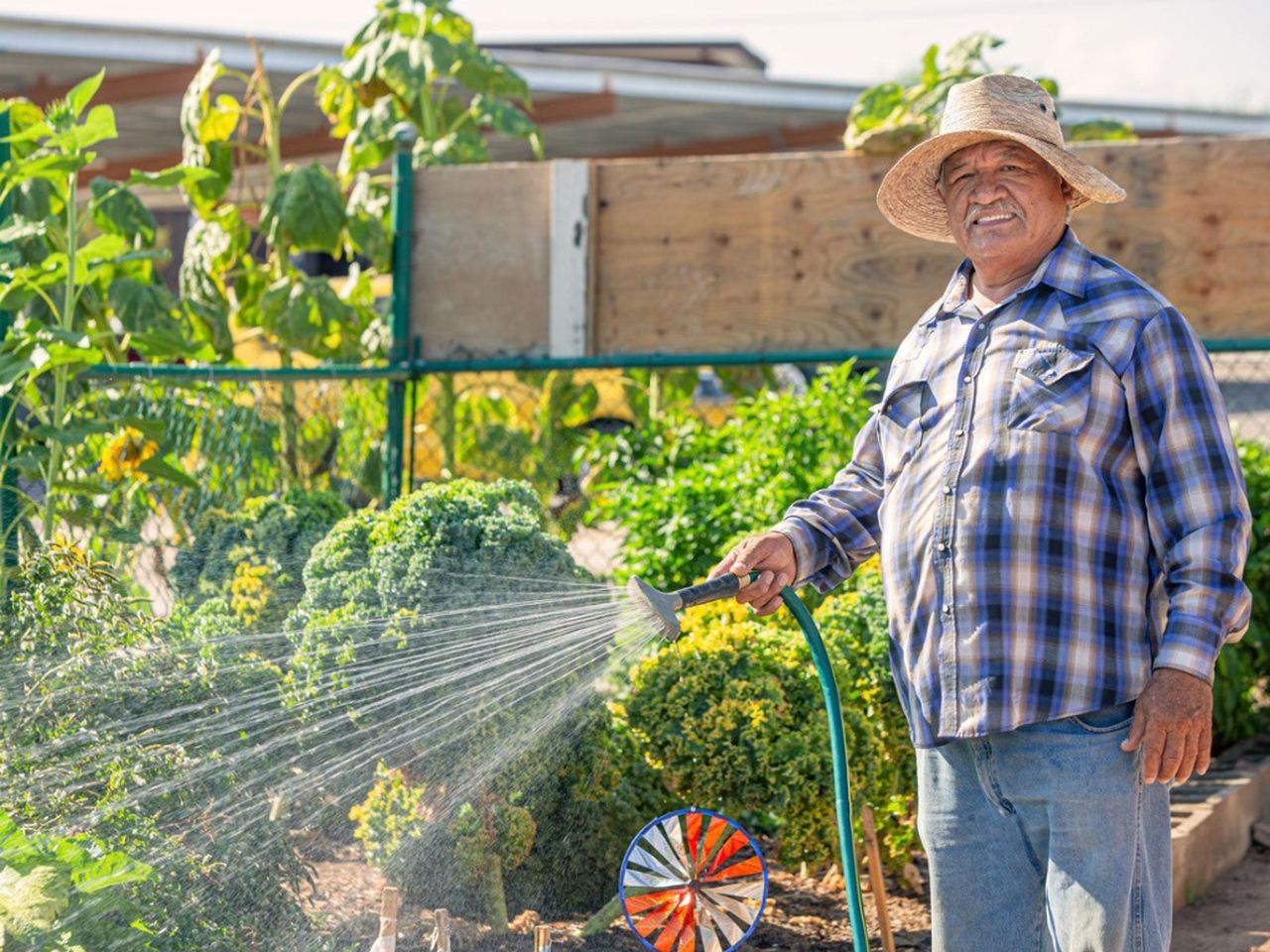 Gardener Watering Plants