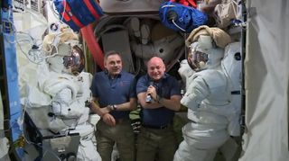 NASA astronaut Scott Kelly (right) and Russian cosmonaut Mikhail Kornienko on the International Space Station speak with members of the press via a video link on Monday, Sept. 14, 2015. Tuesday (Sept. 15) marks the halfway point of their one-year mission, which will keep them on the station until March 2016.