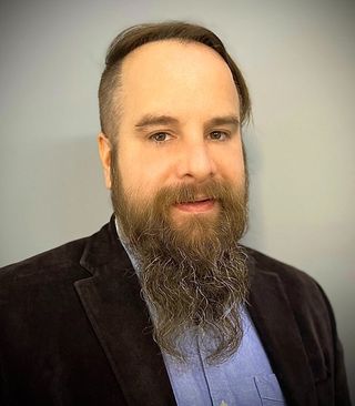 Headshot of the bearded Jonathan von Rentzell.