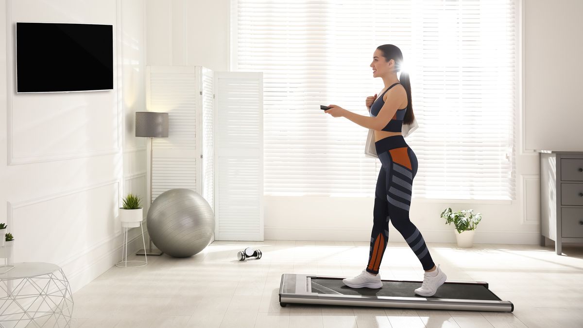 Woman walking on a treadmill