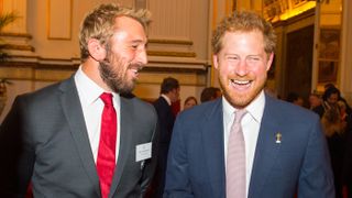 LONDON, UNITED KINGDOM - OCTOBER 12: England Rugby Union Captain Chris Robshaw (left) speaks with Prince Harry at a reception at Buckingham Palace on October 12, 2015 in London, United Kingdo