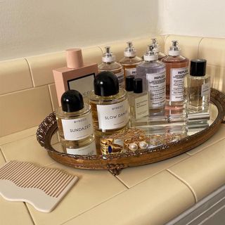 Perfumes atop a vanity.