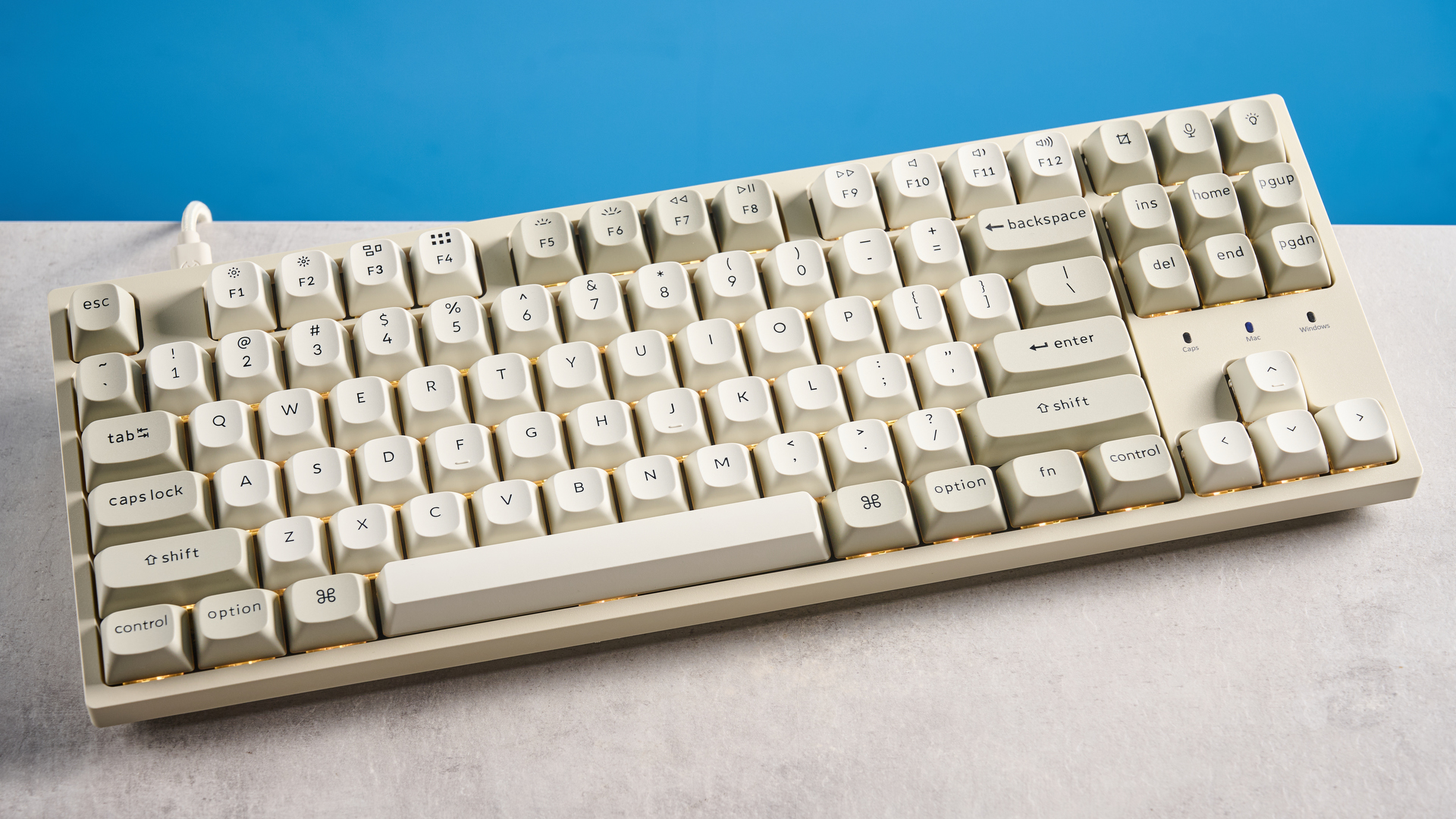 Keychron C1 Pro 8K photographed in front of a blue background.
