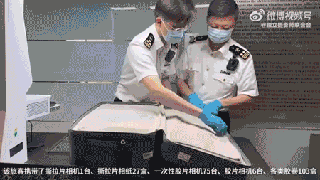 Smuggled cameras and film, seized by Chinese customs agents