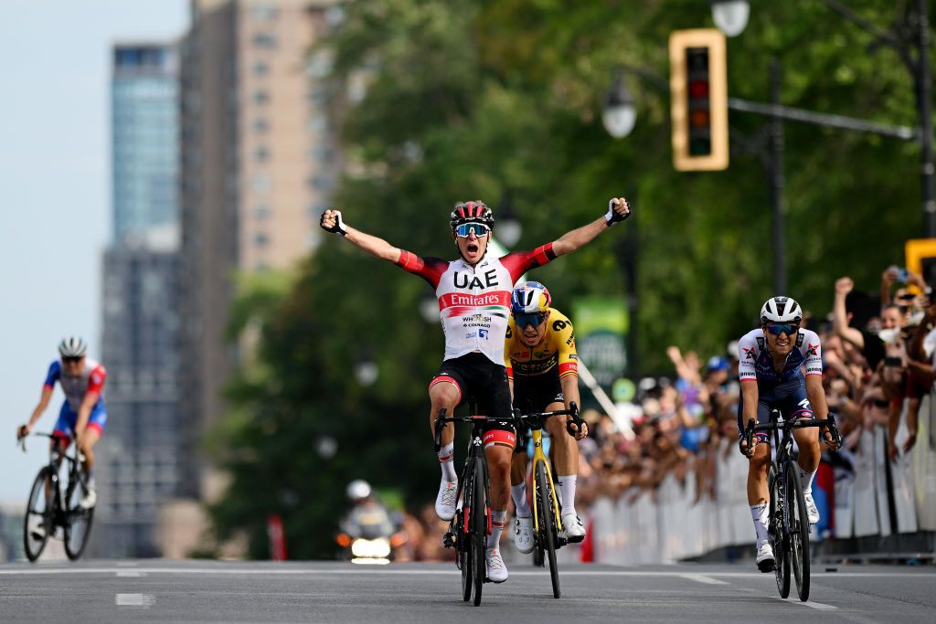 MONTREAL QUEBEC SEPTEMBER 11 Tadej Pogacar of Slovenia and UAE Team Emirates celebrates winning ahead of Wout Van Aert of Belgium and Team Jumbo Visma Andrea Bagioli of Italy and Team QuickStep Alpha Vinyl and David Gaudu of France and Team Groupama FDJ during the 11th Grand Prix Cycliste de Montreal 2022 a 221km one day race from Montreal to Montreal GPCQM WorldTour on September 11 2022 in Montreal Quebec Photo by Dario BelingheriGetty Images