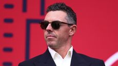 Rory McIlroy in suit and sunglasses ahead of the 2025 Ryder Cup