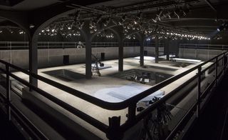 warehouse-like space with lights for the show
