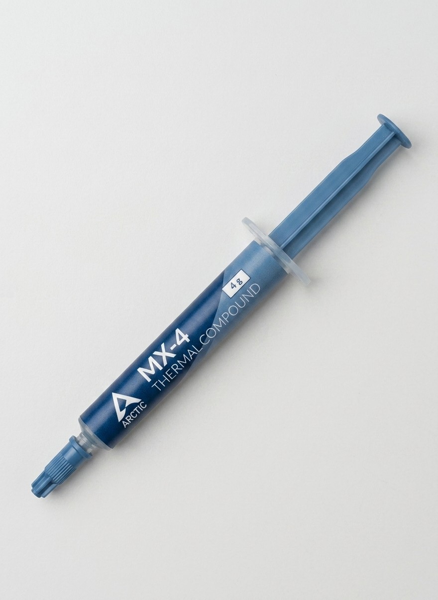 A syringe of Arctic MX-4 thermal paste on a grey background
