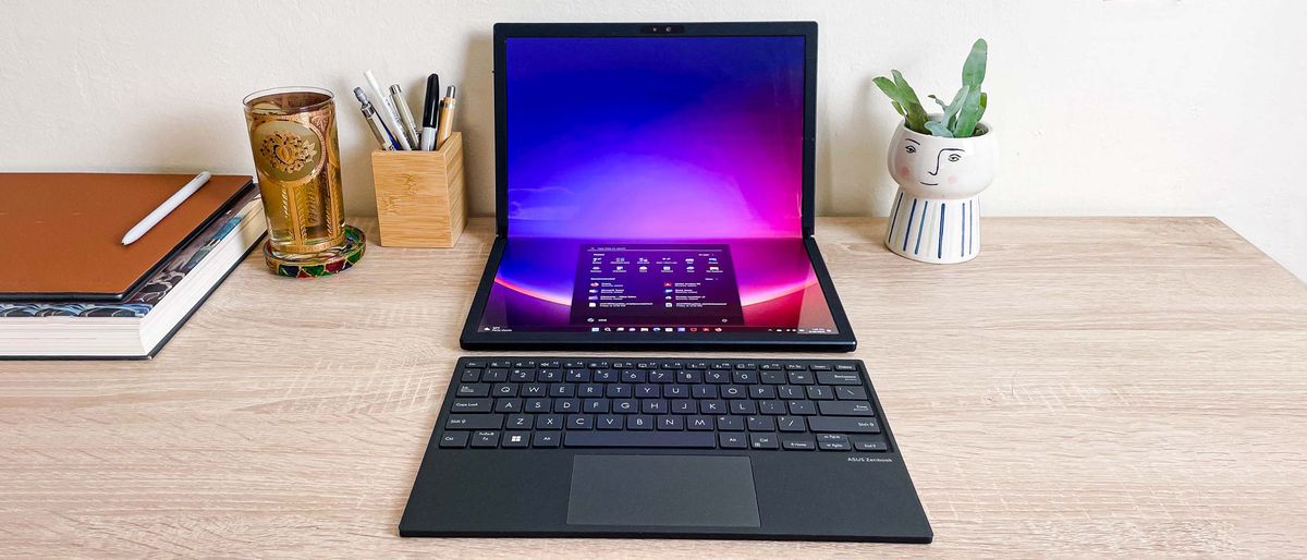 Asus Zenbook 17 Fold OLED review unit on desk with bluetooth keyboard in front of it