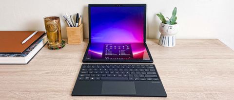Asus Zenbook 17 Fold OLED review unit on desk with bluetooth keyboard in front of it