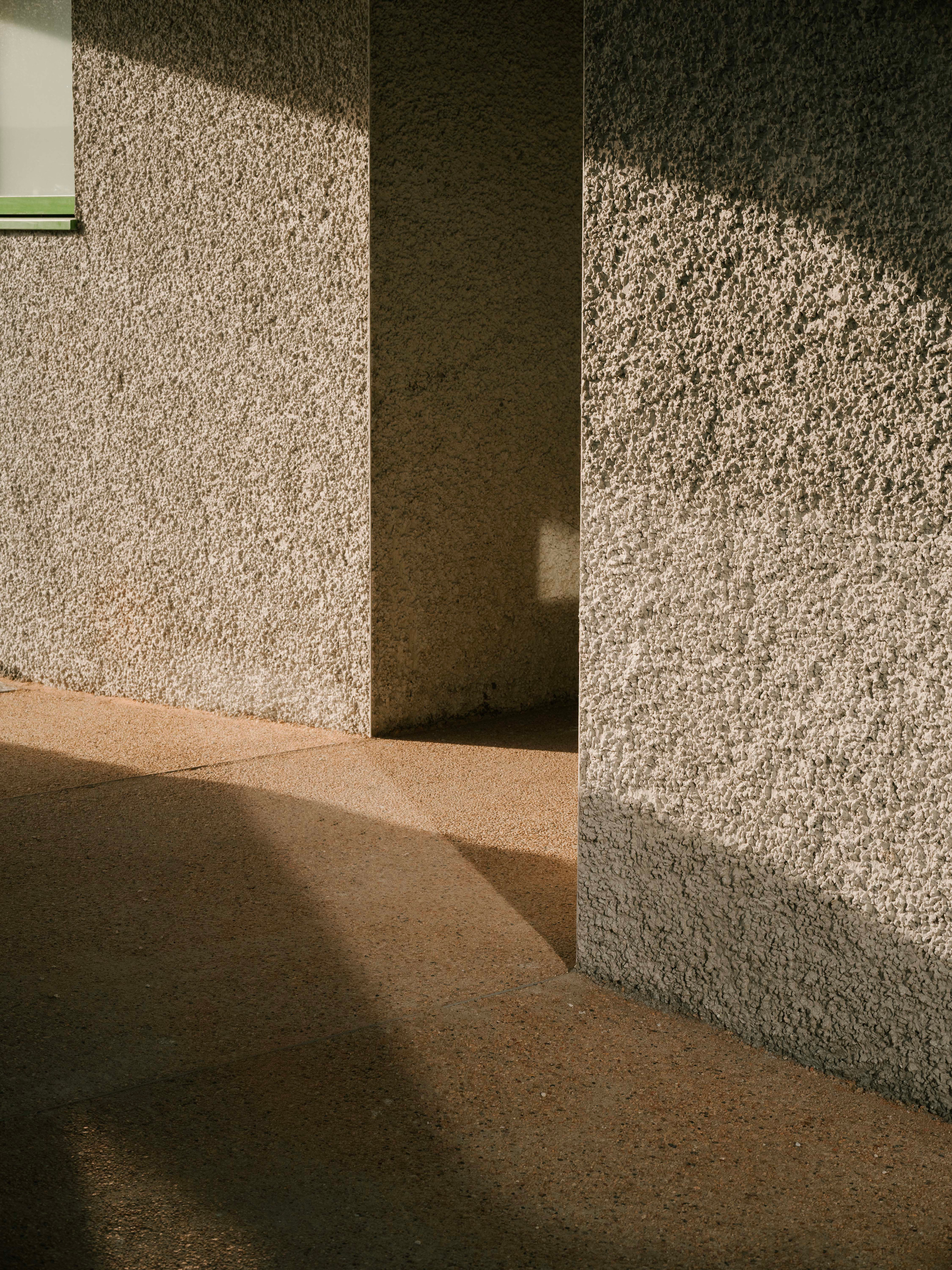 The exterior walls have a rough, hard-wearing finish