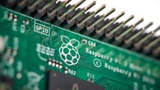 Close-up detail of the Raspberry Pi Foundation logo on a Raspberry Pi 3 Model B single-board computer.