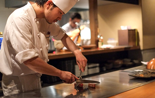 Kobe beef being prepared by a Japanese chef