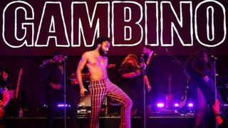 Childish Gambino on stage, below stylised lettering of his name 